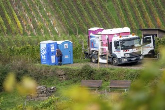 Emptying and cleaning mobile toilets Dixi toilets, Toi-Toi toilets in the vineyard in the Ahr