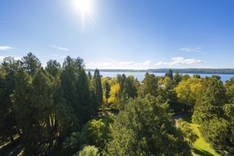 Extensive view over green forests to a distant lake under a clear sky, Überlingen, Lake Constance,