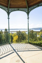 Metal pavilion with view of lake and forests under bright skies, Überlingen, Lake Constance,