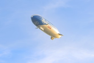 Zeppelin under a clear, cloudless sky, carrying an advertising message, Überlingen, Lake Constance,