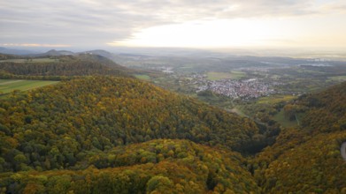 Indian summer at sunset on Albtrauf with a view of the Hohenneuffen castle ruins