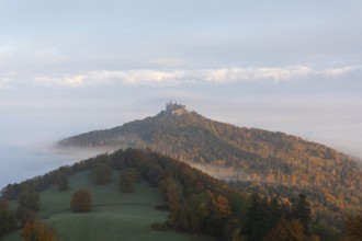 Hohenzollern Castle in a sea of fog at sunrise, autumn in the Swabian Jura