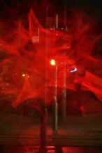 Traffic light, road traffic at night and poor visibility in a city, autumn, Germany