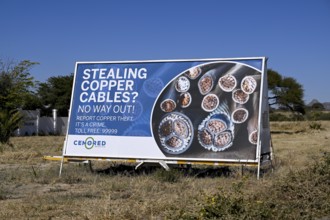 Warning sign for stealing copper cables, Otjiwarongo, Otjozondjupa region, Namibia