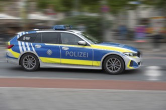 Police car in action, Erlangen, Middle Franconia, Bavaria, Germany