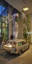 Entrance area to Monkey Bar with old Trabi in the evening, Charlottenburg, Berlin, Germany
