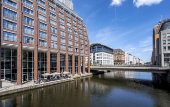 Brick building and canal, Alsterfleet and Graskeller Bridge, Hamburg Mitte, Hamburg, Germany