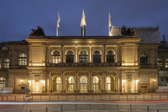 Building of the Hamburg Chamber of Commerce at blue hour with a strip of light in the foreground,