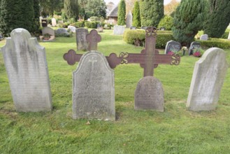Cemetery of St John's Church with gravestones telling the story of seafarers, known as talking