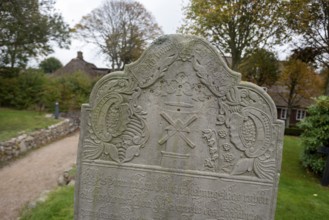 Close-up of a baroque gravestone in the cemetery of St John's Church, Nieblum, Föhr Island,