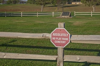 Canton, South Dakota - A sign warns golfers not to play inside a graveyard where 120 patients of