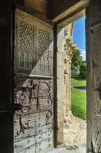 Entrance door of the romanesque church of Mailhat, Puy de Dome department, Auvergne-Rhone-Alpes,