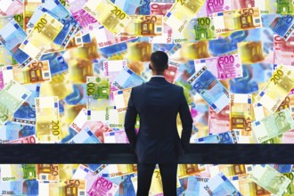 Symbol photo, manager with euro, financial economy, stock market, banks, money flows, devaluation,