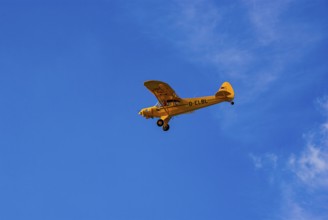A Piper PA-18 Super Cub of the Bravo Lima Formation during a flight demonstration as part of an air