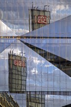 Cube Berlin, cube-shaped office building with folded glass façade reflecting the surroundings,