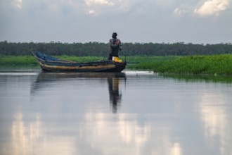 Fishermen at work on a waterway, Mabamba Swamp, Lake Victoria, Uganda