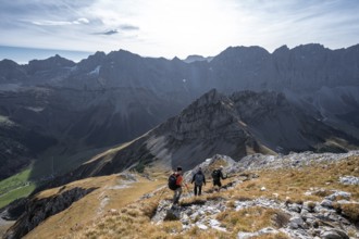 Group of mountaineers descending from the Gamsjoch, in autumn, mountain panorama with