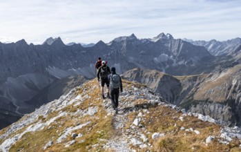 Mountain panorama with picturesque mountain landscape, group of mountaineers descending from the