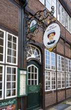 Nose sign and entrance to Oma's Cafe and Bistro in the Krameramtsstuben, historic building,