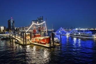 View of illuminated ships on the Elbe promenade with restaurant Das Feuerschiff LV 13, City