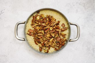 Risoni pasta is perfectly cooked and served in a large pan. It is generously topped with