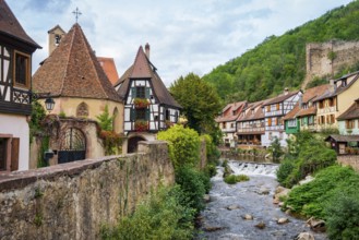 Picturesque Kaysersberg with half-timbered houses on the Weiss river in the old town centre