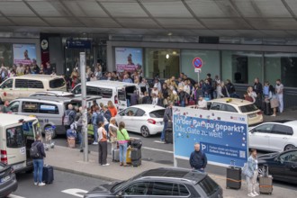 Ahead of Terminal B, many thousands of people set off on holiday on the first day of the North