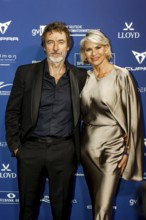 Guido Broscheit with partner Barbara Klein on the red carpet in front of the award ceremony at the