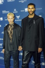 Eliob Demofike with partner Myat on the red carpet in front of the award ceremony at the Pullmann