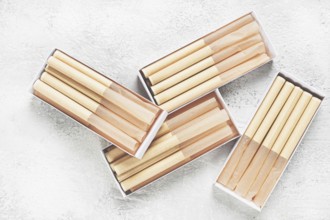 Cigarette casings, packed in boxes, on the table, top view