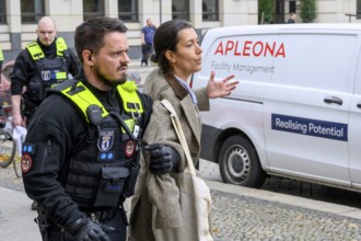 Arrest of a New Generation activist on Pariser Platz after a symbolic house search at the Stiftung