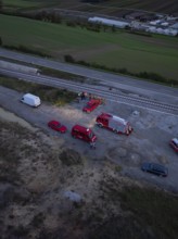 Aerial view of an operation site on railway tracks, several fire engines can be seen, fire drill in