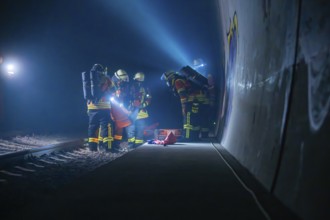 Fire brigade team in the tunnel during an exercise with various utensils, fire brigade exercise in