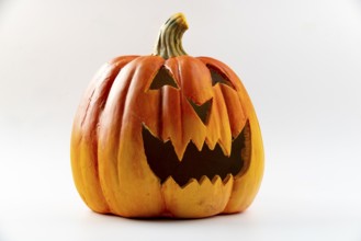 Scary orange pumpkin, Halloween, white background