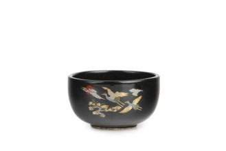 Black bowl with golden cranes, Asian decor, white background