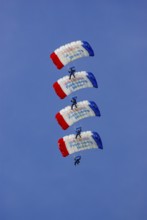 Parachutists during an aerial acrobatic demonstration as part of an air show on the Rossfeld in