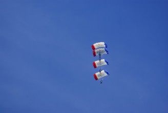 Parachutists during an aerial acrobatic demonstration as part of an air show on the Rossfeld in