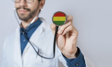 Doctor holding stethoscope with Bolivia flag. Bolivia health and care concept. Bolivia flag on