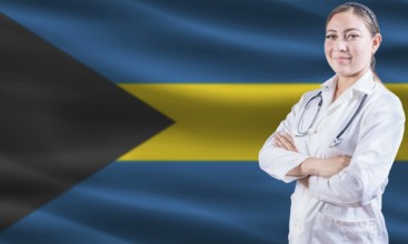 Female doctor on Bahamas flag. Doctor with crossed arms on Bahamas flag. Bahamas health and care