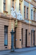 Statues above the entrance door at the Romanus House, Brühl, Leipzig, Saxony, Germany