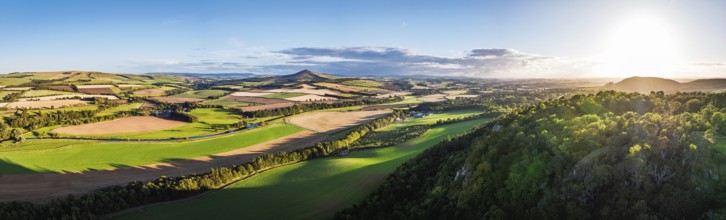 Panorama of evening Fields and Farms over River Teviot and Minto Crags from a drone, Roxburghshire,