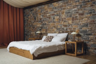Cozy bedroom with stone wall and rustic furnishings for a relaxing atmosphere. Simple wooden