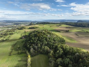 Aerial view of the Hegau volcano and the Mägdeberg castle ruins, on the horizon the Hohenkrähen and