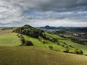 Aerial view of the Hegau volcano and the Mägdeberg castle ruins, Hohenhewen on the horizon on the