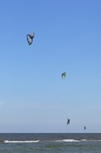 Two kitesurfers jumping, Baltic Sea, Falshöft, Pommerby, Schleswig-Holstein, Germany