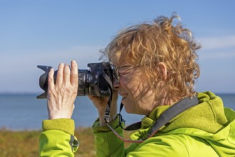 Elderly woman photographed, Baltic Sea, Geltinger Birk nature reserve, Nieby, Schleswig-Holstein,