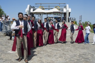 Group in traditional costumes at a festive gathering, folklore, Tatev, Tatev, Syunik province,