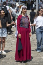 Woman in red traditional dress at an outdoor event, folklore, Tatev, Tatev, Syunik province,