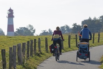 Lighthouse, cyclist, Falshöft, Pommerby, Schleswig-Holstein, Germany