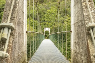 Metal suspension bridge crossing the sella river, connecting the dobra river route with the olla de